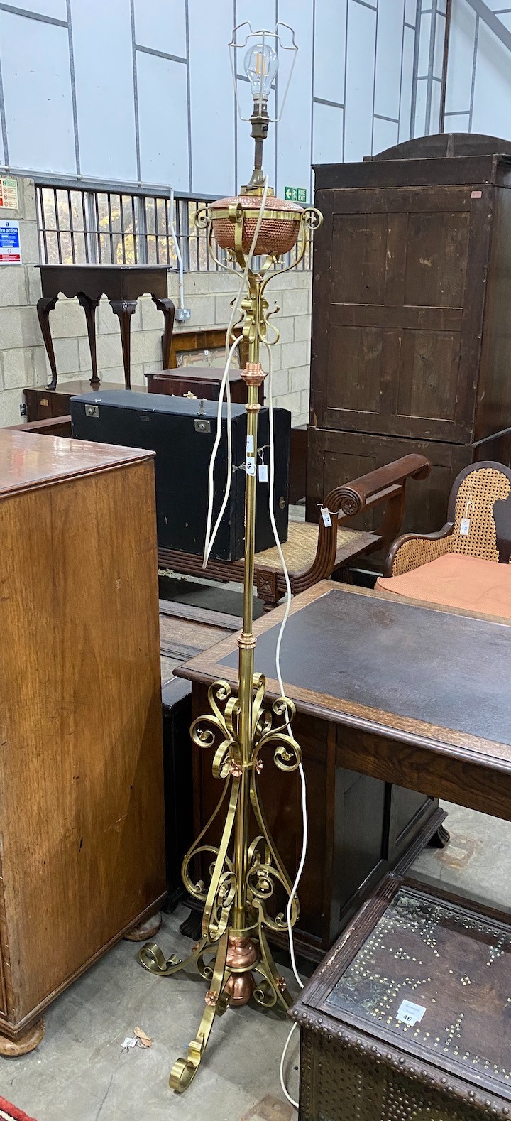 An Art Nouveau brass and copper telescopic oil standard lamp converted to electricity